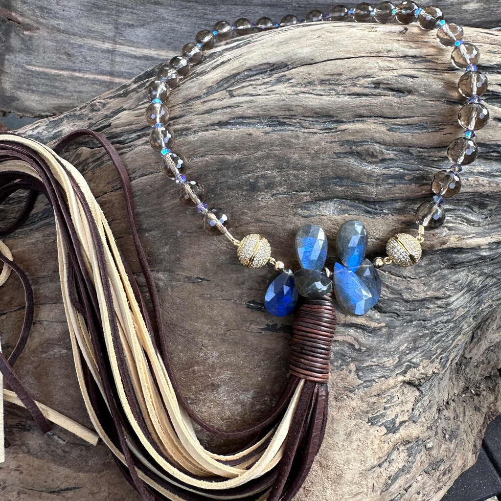 Our Smokey Quartz and Crystal Necklace with an Eternity Lynx Tassel attached to it!